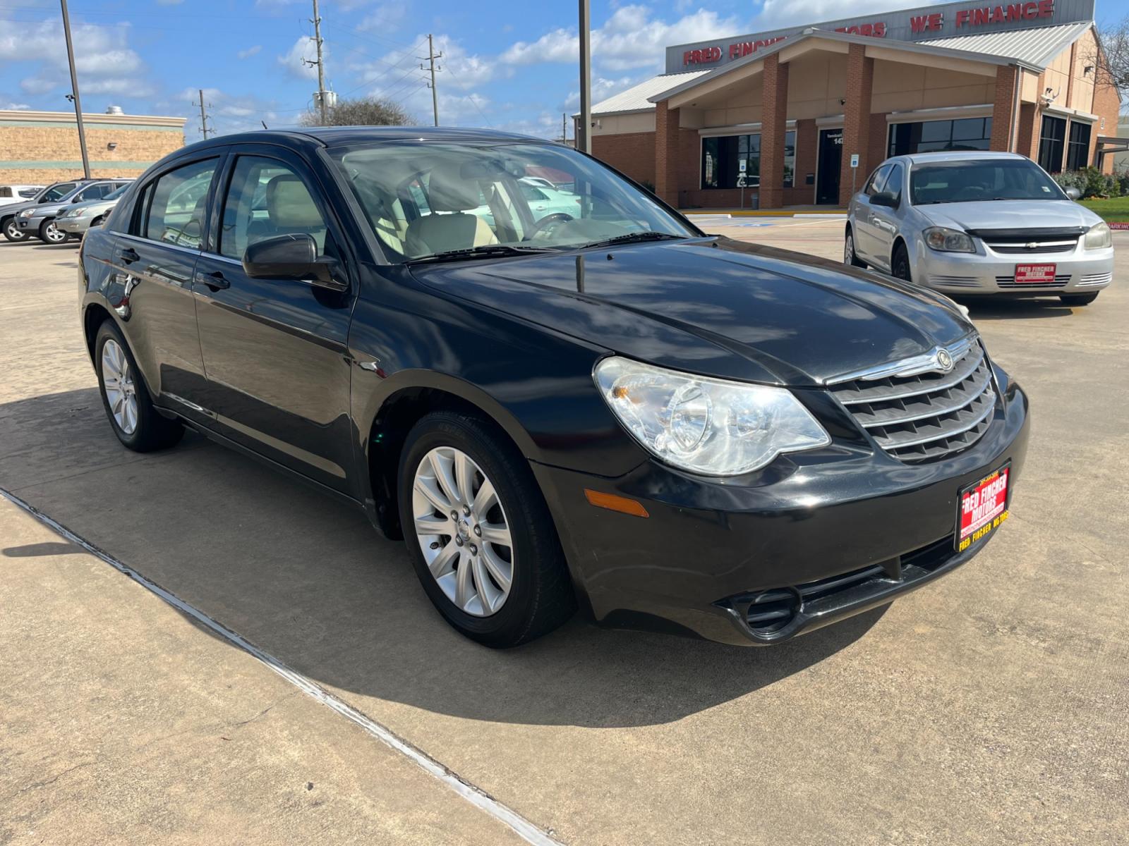 2010 Black /TAN Chrysler Sebring Sedan Limited (1C3CC5FB2AN) with an 2.4L L4 DOHC 16V engine, 4-Speed Automatic transmission, located at 14700 Tomball Parkway 249, Houston, TX, 77086, (281) 444-2200, 29.928619, -95.504074 - Photo #0
